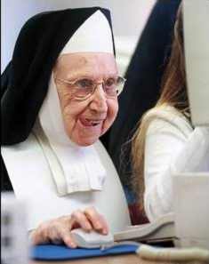 Nun At Computer